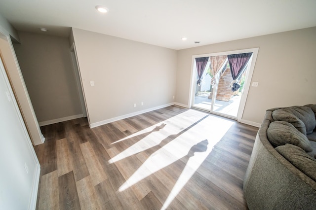1004 Blanch Ct, Mantorville, MN 55955 - living area with wood finished floors, baseboards, and recessed lighting
