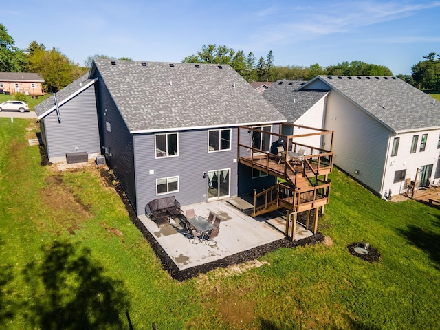 1004 Blanch Ct, Mantorville, MN 55955 - rear view of house featuring a deck, a patio, roof with shingles, a yard, and stairs