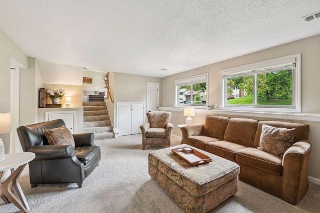 1686 Walnut Ln, Eagan, MN 55122 - living room with carpet flooring, a textured ceiling, stairs, and baseboards