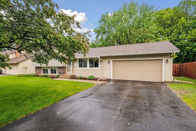 1686 Walnut Ln, Eagan, MN 55122 - split level home with driveway, an attached garage, and roof with shingles
