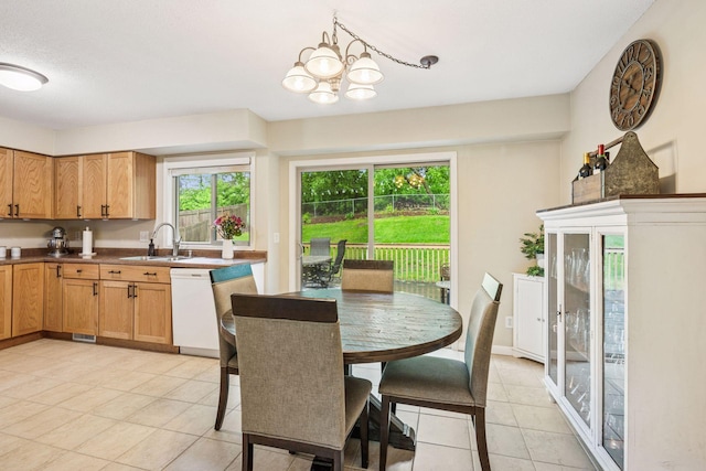 1686 Walnut Ln, Eagan, MN 55122 - dining space featuring light tile patterned floors, plenty of natural light, and a chandelier