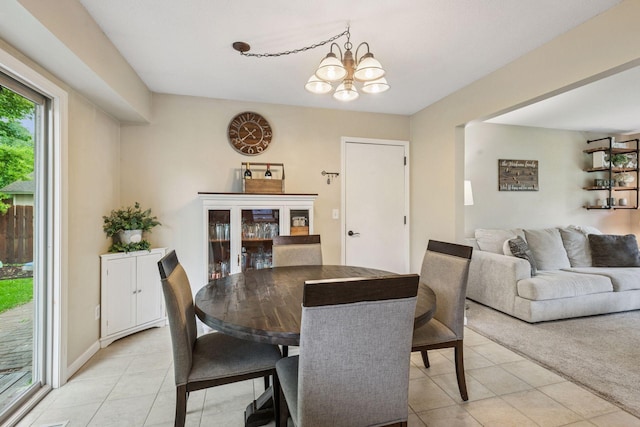 1686 Walnut Ln, Eagan, MN 55122 - dining room featuring light tile patterned floors and a chandelier