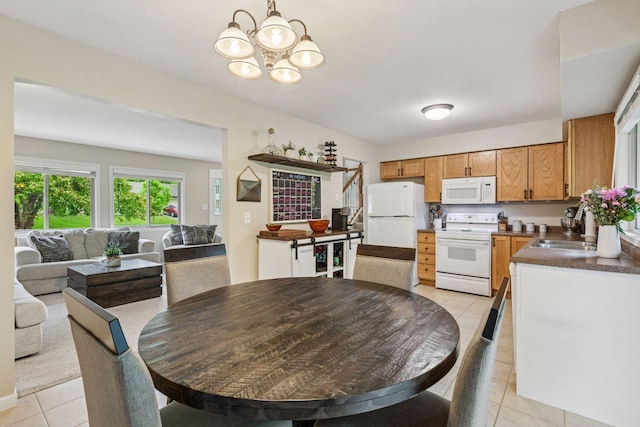 1686 Walnut Ln, Eagan, MN 55122 - dining area featuring light tile patterned floors and a chandelier