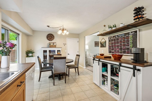 1686 Walnut Ln, Eagan, MN 55122 - dining area with light tile patterned flooring, a chandelier, and baseboards