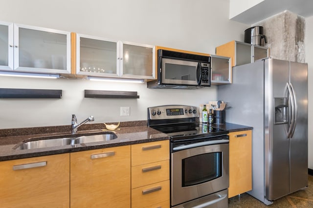 350 Saint Peter St Unit 701, Saint Paul, MN 55102 - kitchen with stainless steel appliances, a sink, dark stone counters, and glass insert cabinets