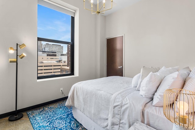 350 Saint Peter St Unit 701, Saint Paul, MN 55102 - bedroom with a chandelier and baseboards