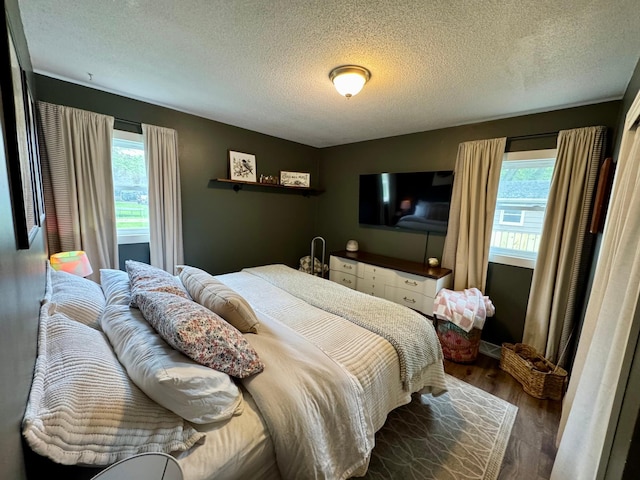 2728 Pine Ave, Slayton, MN 56172 - bedroom with wood finished floors and a textured ceiling