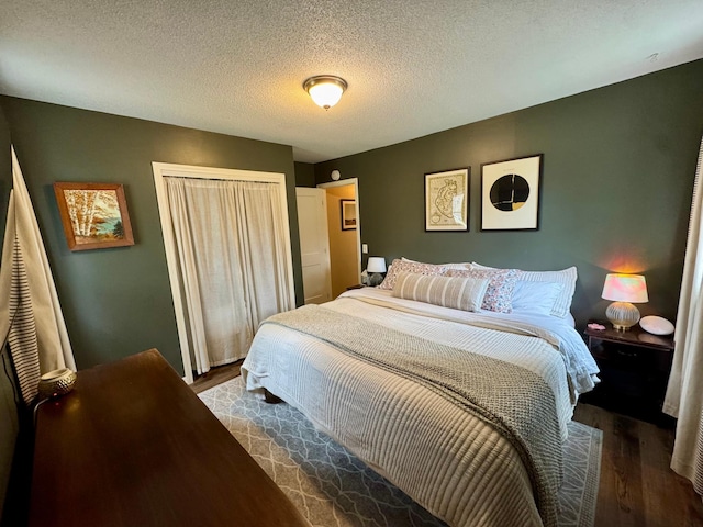 2728 Pine Ave, Slayton, MN 56172 - bedroom with wood finished floors, a closet, and a textured ceiling