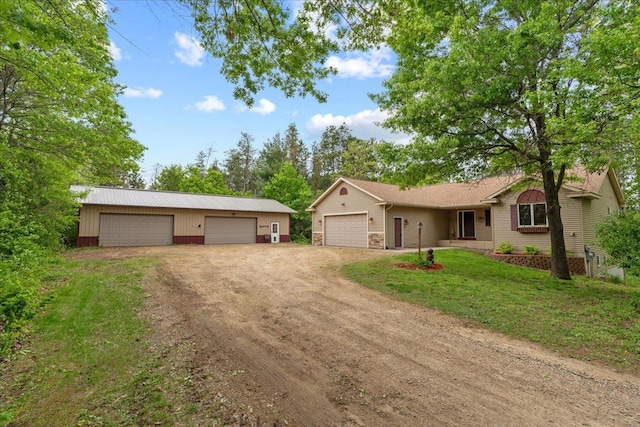 2136 54th St, Somerset, WI 54025 - single story home with a front yard, a detached garage, and driveway