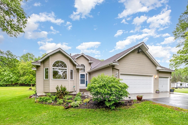 39 154th Ave NE, Ham Lake, MN 55304 - view of front of home featuring asphalt driveway, a garage, and a front yard
