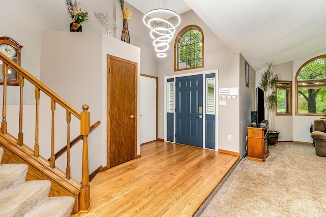 39 154th Ave NE, Ham Lake, MN 55304 - entryway featuring high vaulted ceiling, a chandelier, stairway, and baseboards