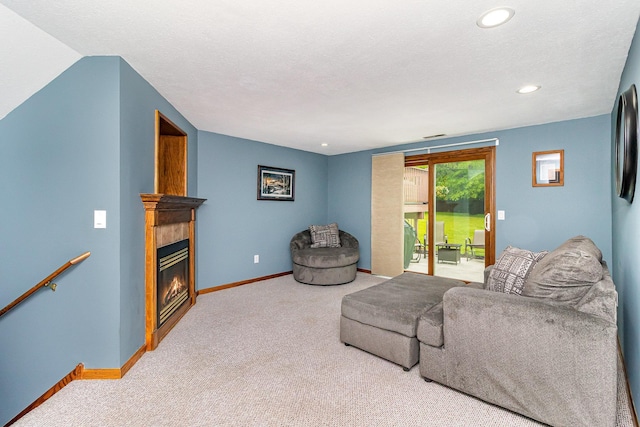 39 154th Ave NE, Ham Lake, MN 55304 - carpeted living room featuring recessed lighting, a glass covered fireplace, and baseboards
