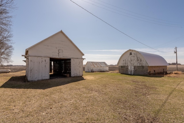 36350 276th St, Henderson, MN 56044 - view of grassy yard featuring an outdoor structure and a barn