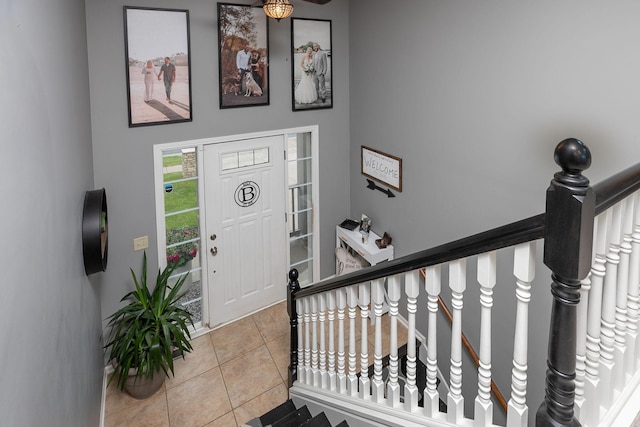 907 Rodeo Dr SE, Pine Island, MN 55963 - foyer featuring light tile patterned flooring and stairs