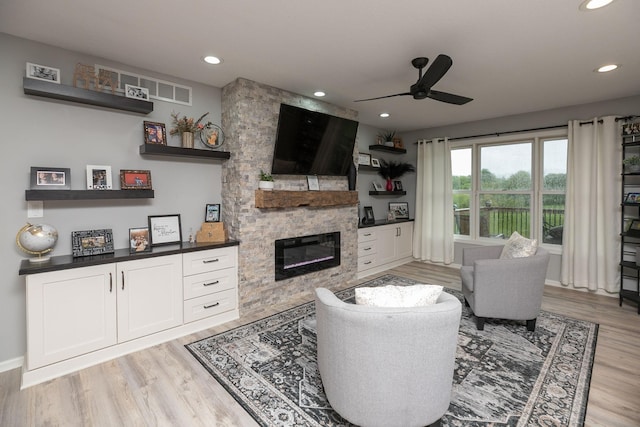 907 Rodeo Dr SE, Pine Island, MN 55963 - living room featuring ceiling fan, a fireplace, light wood finished floors, recessed lighting, and baseboards
