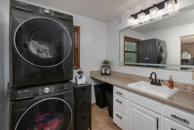 907 Rodeo Dr SE, Pine Island, MN 55963 - laundry room with stacked washer / drying machine, cabinet space, and light tile patterned flooring