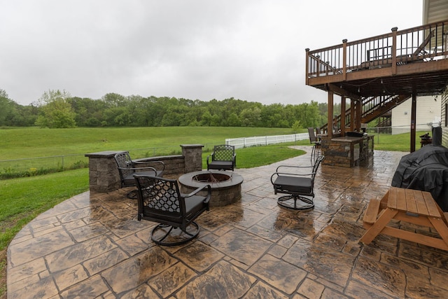 907 Rodeo Dr SE, Pine Island, MN 55963 - view of patio / terrace with an outdoor fire pit, stairs, a wooden deck, and a forest view