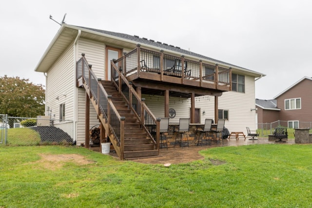 907 Rodeo Dr SE, Pine Island, MN 55963 - back of property featuring a wooden deck, stairway, and a patio area