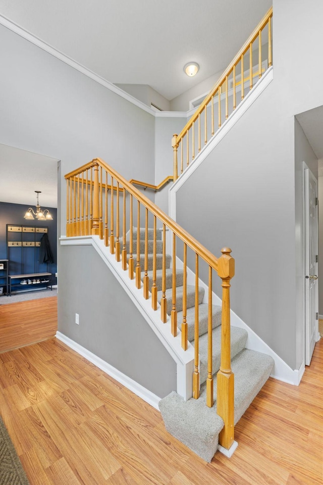 27385 Millicent Ln, Chisago Lake Twp, MN 55013 - stairs with wood finished floors, baseboards, and a chandelier