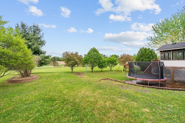 27385 Millicent Ln, Chisago Lake Twp, MN 55013 - view of green lawn with a trampoline and a playground