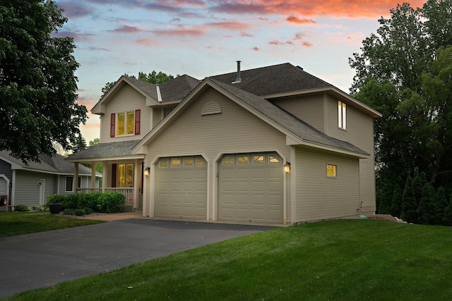 500 Mackubin Cir, Shoreview, MN 55126 - view of front of property featuring an attached garage, driveway, a front yard, a shingled roof, and covered porch