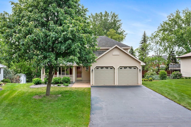 500 Mackubin Cir, Shoreview, MN 55126 - view of front of home featuring a porch, an attached garage, a front yard, and driveway