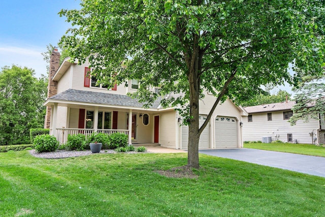 500 Mackubin Cir, Shoreview, MN 55126 - view of front of property with covered porch, driveway, a front yard, a chimney, and an attached garage