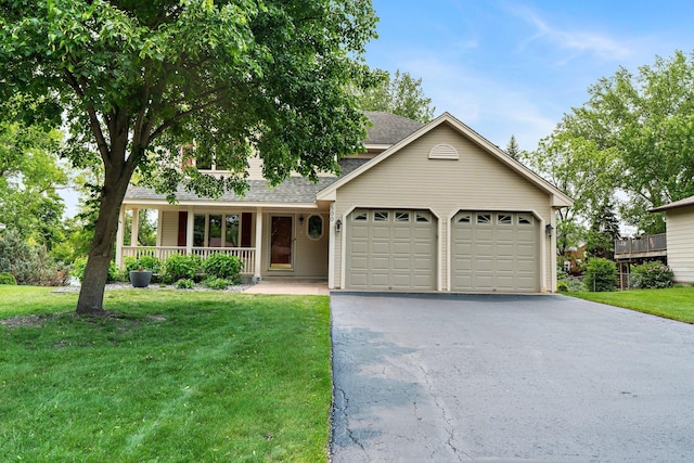 500 Mackubin Cir, Shoreview, MN 55126 - view of front facade with a garage, driveway, covered porch, and a front yard