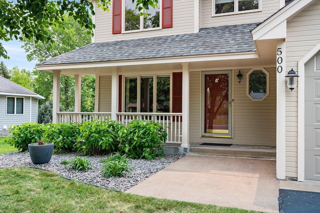 500 Mackubin Cir, Shoreview, MN 55126 - view of exterior entry featuring roof with shingles and covered porch