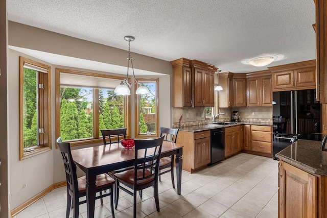 500 Mackubin Cir, Shoreview, MN 55126 - kitchen with dishwasher, freestanding refrigerator, a sink, brown cabinetry, and tasteful backsplash