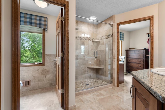 500 Mackubin Cir, Shoreview, MN 55126 - full bath featuring vanity, a shower stall, and a textured ceiling