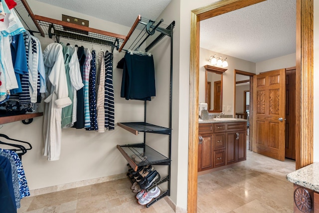 500 Mackubin Cir, Shoreview, MN 55126 - walk in closet featuring a sink