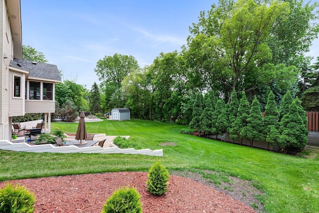 500 Mackubin Cir, Shoreview, MN 55126 - view of grassy yard with a patio