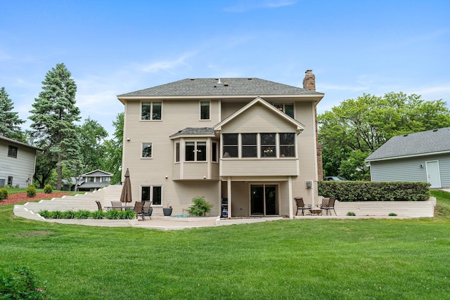 500 Mackubin Cir, Shoreview, MN 55126 - rear view of house featuring a patio area, a chimney, a sunroom, and a yard
