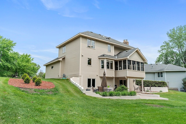 500 Mackubin Cir, Shoreview, MN 55126 - rear view of property featuring a sunroom, a patio, a chimney, a yard, and roof with shingles