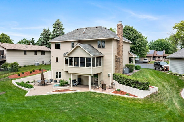 500 Mackubin Cir, Shoreview, MN 55126 - rear view of house with a patio, a sunroom, a chimney, and central AC