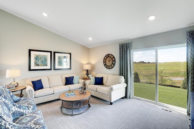 living room featuring vaulted ceiling, carpet floors, and recessed lighting