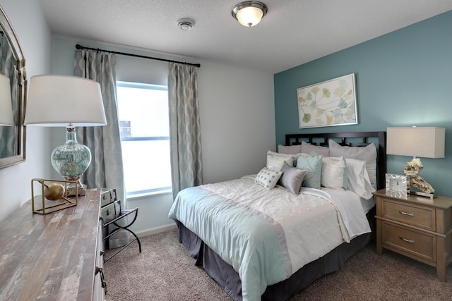 bedroom featuring carpet flooring and baseboards