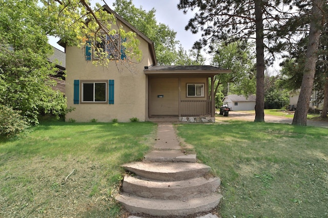 809 7th St, Brainerd, MN 56401 - view of front of home with stucco siding and a front lawn