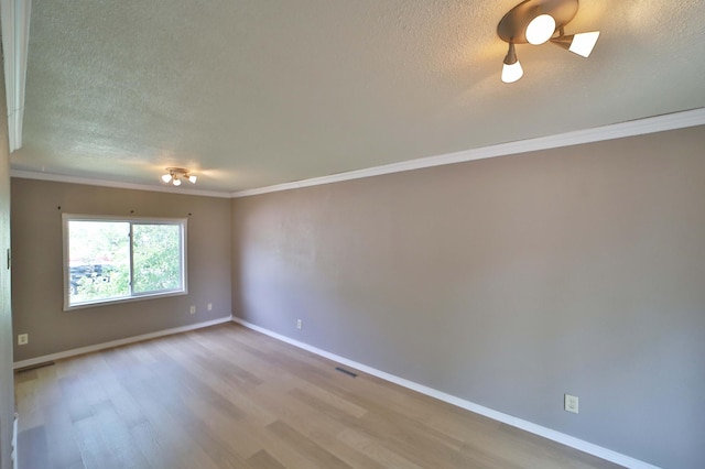 809 7th St, Brainerd, MN 56401 - unfurnished room with a textured ceiling, wood finished floors, ornamental molding, and baseboards