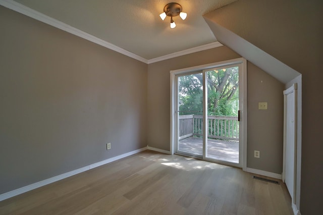809 7th St, Brainerd, MN 56401 - unfurnished room with wood finished floors, baseboards, lofted ceiling, and ornamental molding