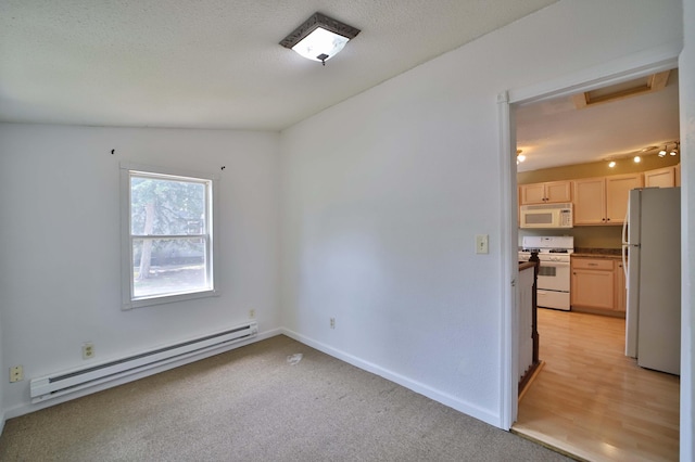 809 7th St, Brainerd, MN 56401 - empty room featuring a baseboard heating unit, attic access, light carpet, baseboards, and a textured ceiling