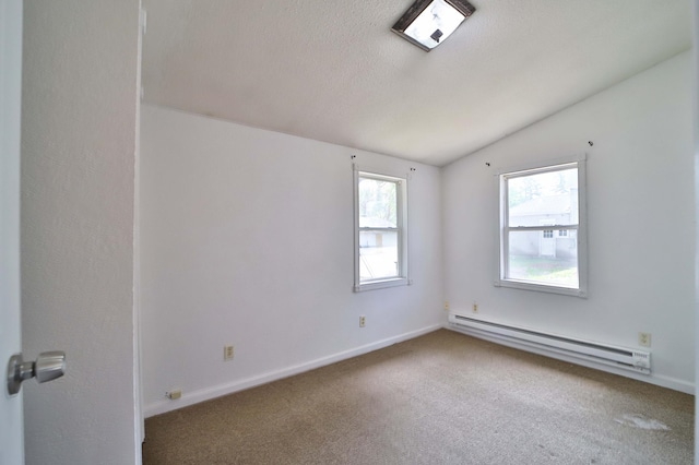 809 7th St, Brainerd, MN 56401 - carpeted spare room featuring baseboard heating, vaulted ceiling, baseboards, and a textured ceiling