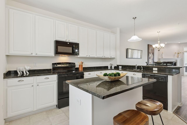 9675 Toledo Ln N, Brooklyn Park, MN 55443 - kitchen featuring black appliances, a peninsula, a sink, and white cabinets