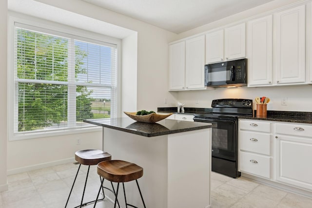 9675 Toledo Ln N, Brooklyn Park, MN 55443 - kitchen featuring black appliances, white cabinetry, a kitchen island, a kitchen bar, and baseboards