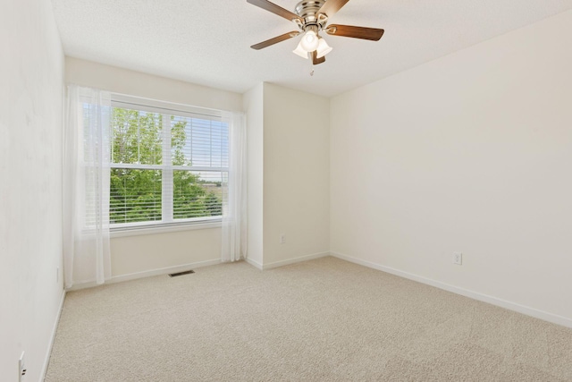 9675 Toledo Ln N, Brooklyn Park, MN 55443 - unfurnished room featuring carpet flooring, a ceiling fan, and baseboards