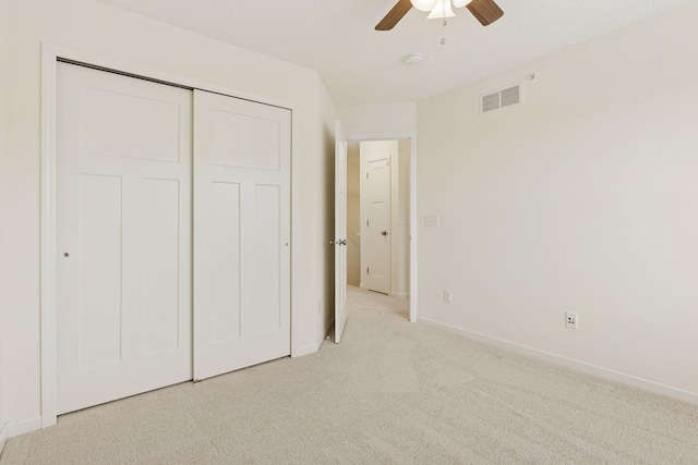 9675 Toledo Ln N, Brooklyn Park, MN 55443 - unfurnished bedroom featuring carpet floors, baseboards, a closet, and a ceiling fan