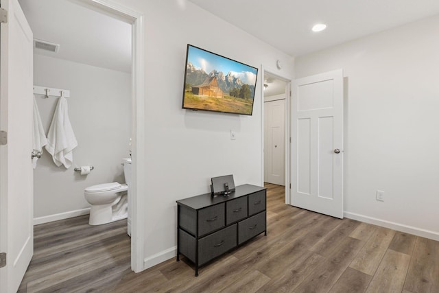 9675 Toledo Ln N, Brooklyn Park, MN 55443 - bedroom featuring wood finished floors, baseboards, connected bathroom, and recessed lighting