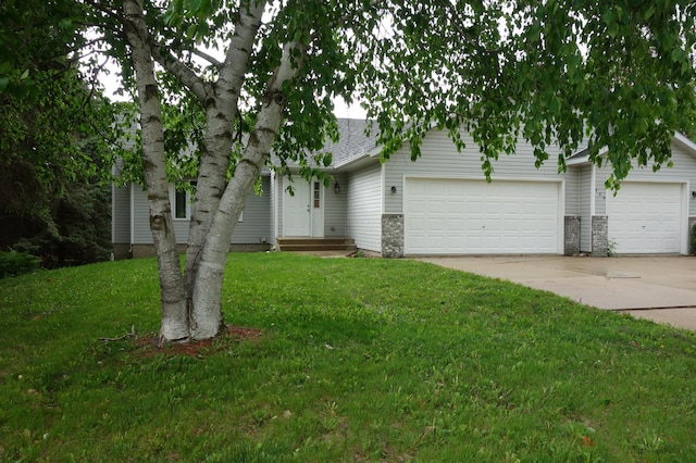 403 Littleford Ln, Faribault, MN 55021 - view of front of home with concrete driveway, an attached garage, a front yard, and a shingled roof