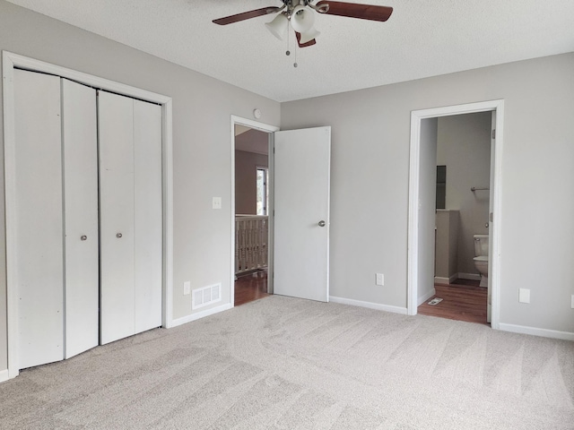 403 Littleford Ln, Faribault, MN 55021 - unfurnished bedroom with carpet floors, a closet, connected bathroom, baseboards, and ceiling fan